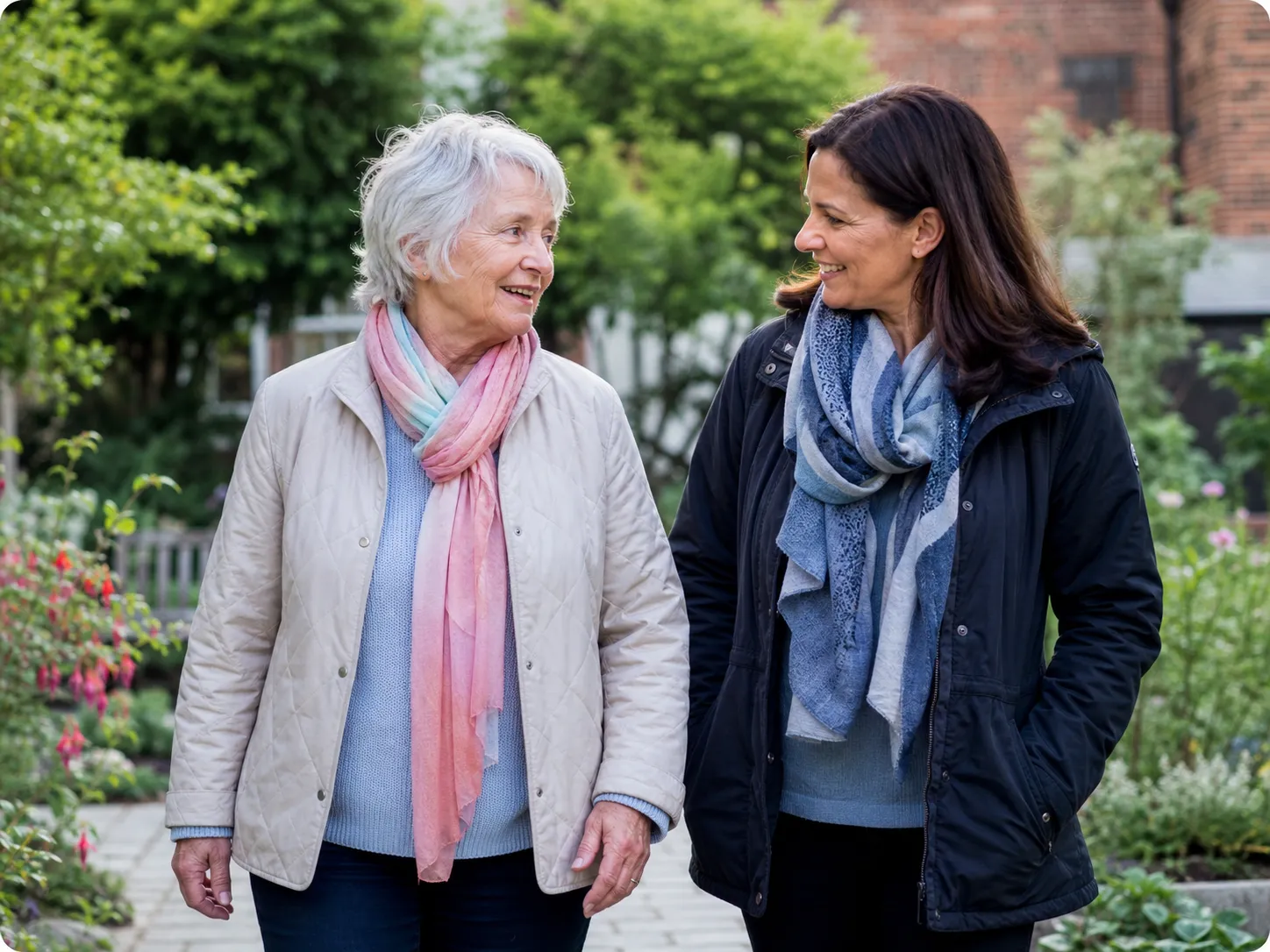 Older woman and community support worker enjoying time outdoors